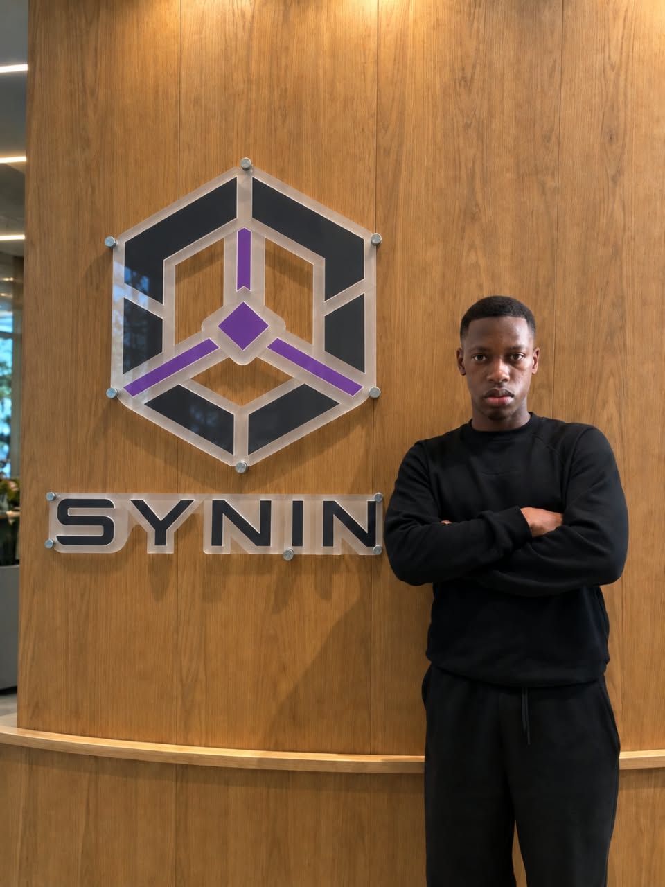 Kenneth Chinonso Abuchi, Founder and CEO of SYNIN AI Lab, at the SYNIN office